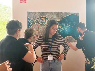 Amali in front of fish canvas and others