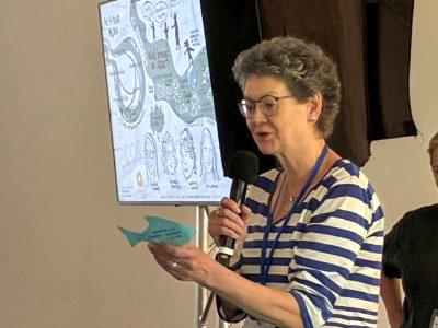 Caroline J reading a fish